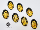 Cherry Amber Engraved Owls Oval Shape Cabochon